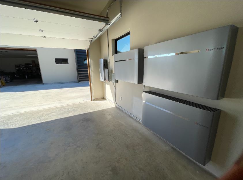 Home battery storage units installed by roofio in a garage in Martindale, Texas