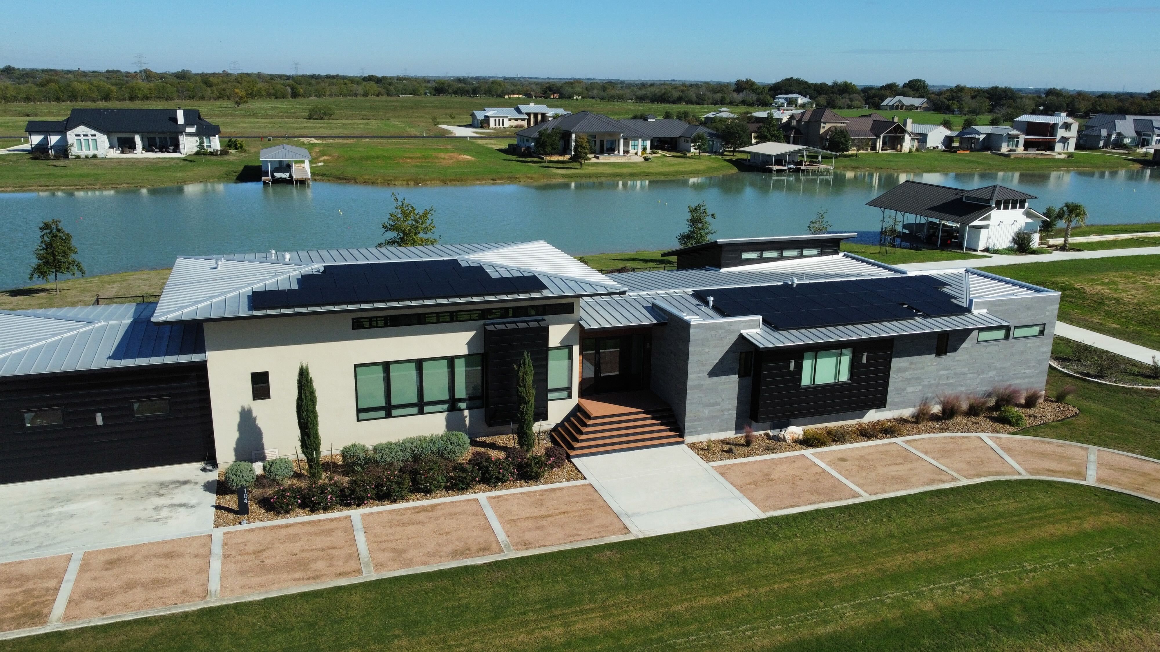 Rooftop solar array designed and installed by roofio on a home in Martindale, Texas