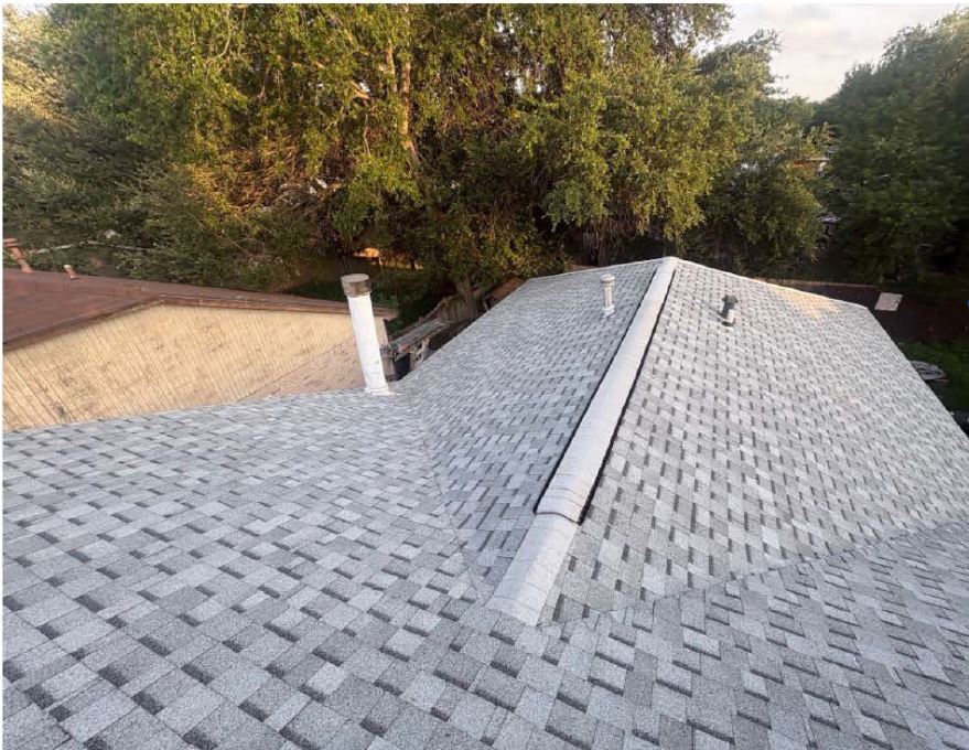 New shingle roof with a fresh ridge vent
