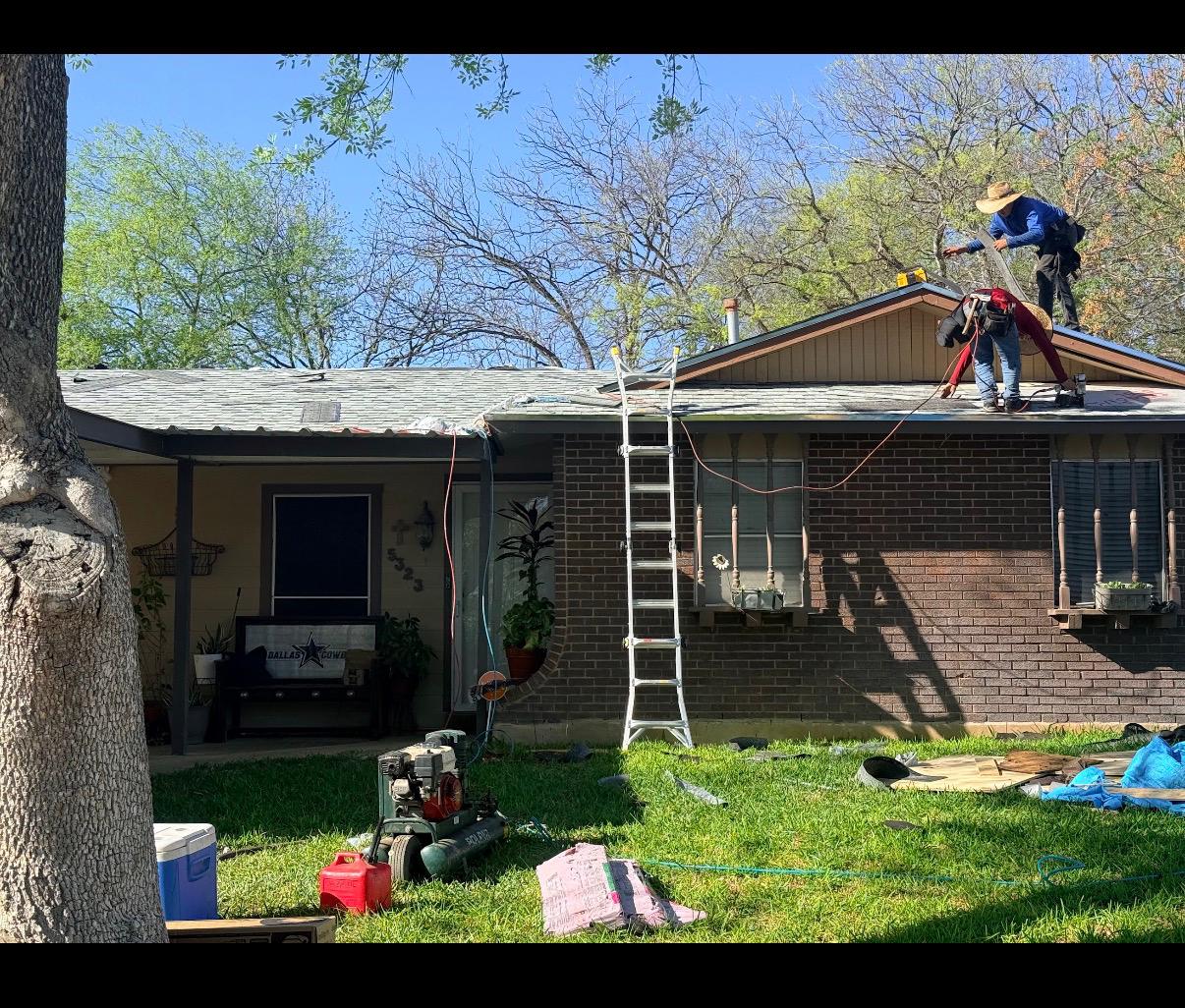 roofio crew on the roof of a San Antonio home during a damage inspection