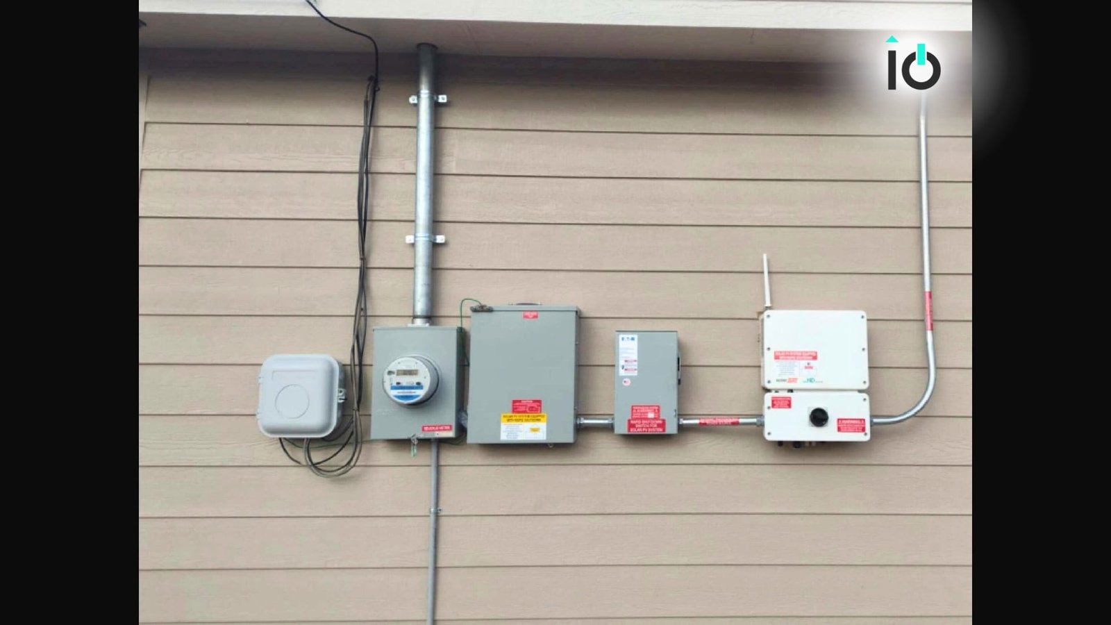 Solar inverter and disconnect equipment mounted on a home exterior wall