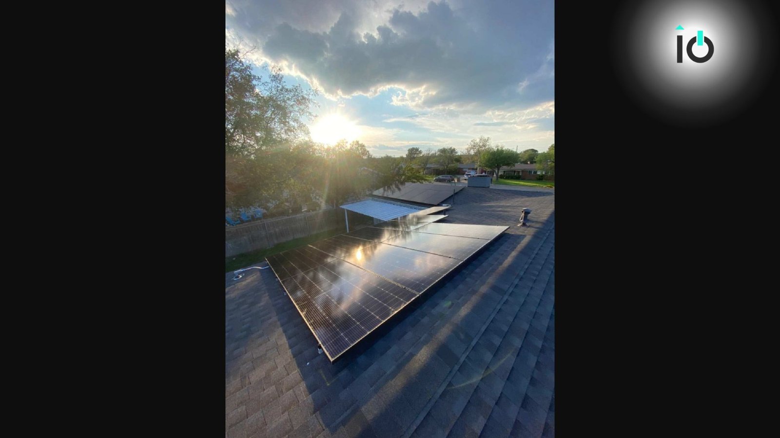 Rooftop solar array photographed at sunset