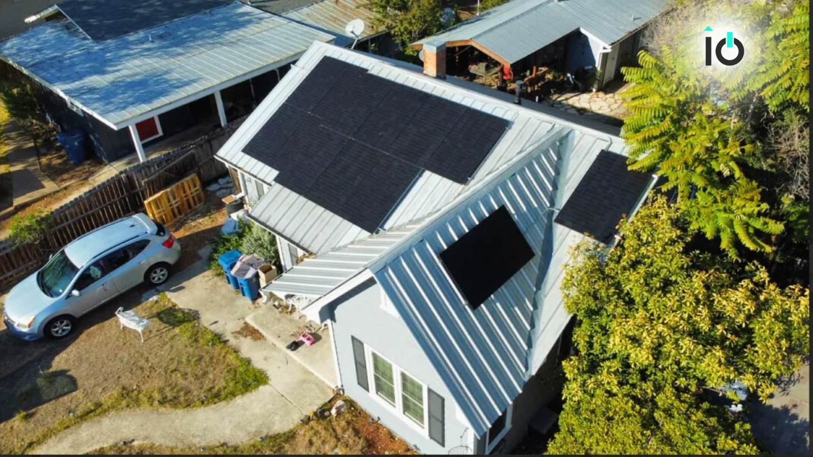 Aerial view of a home with a large rooftop solar array
