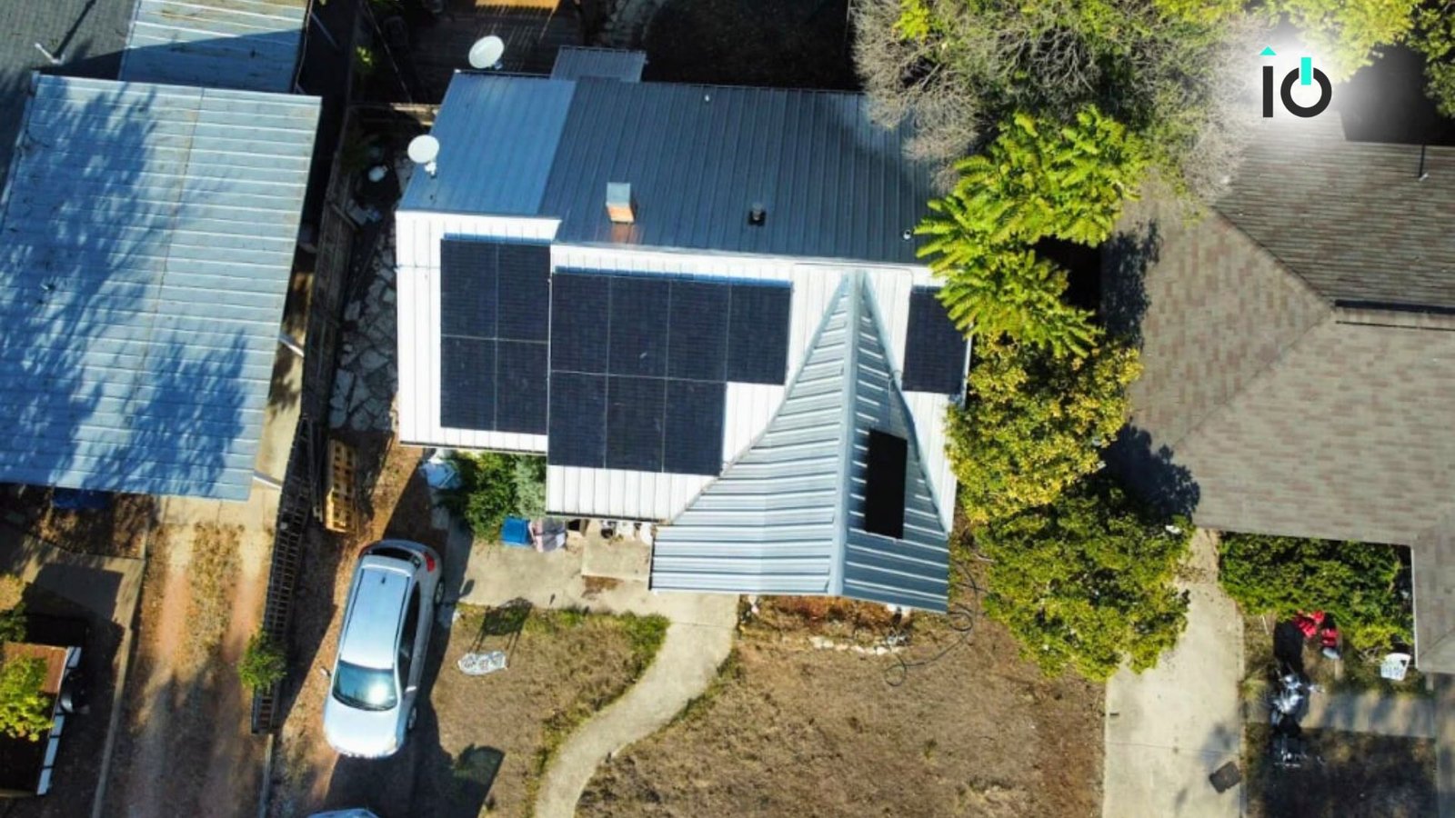 Aerial view of a house with rooftop solar panels