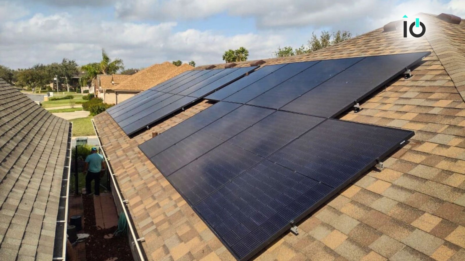 Solar panels running along a shingle roof edge