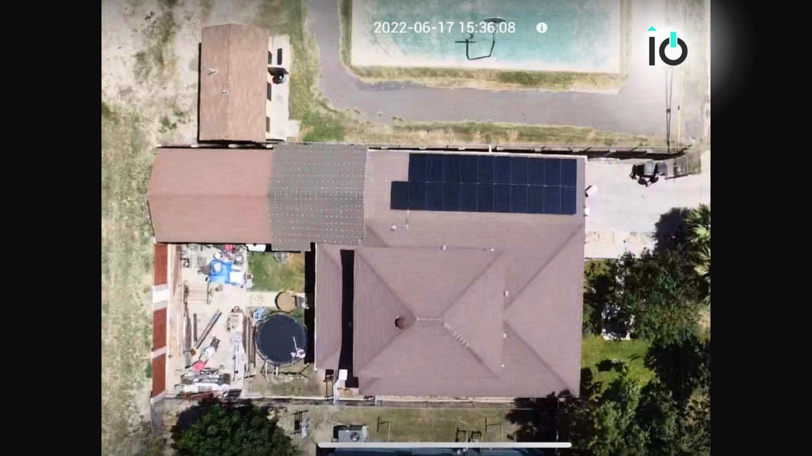 Aerial view of a home with a rooftop solar array