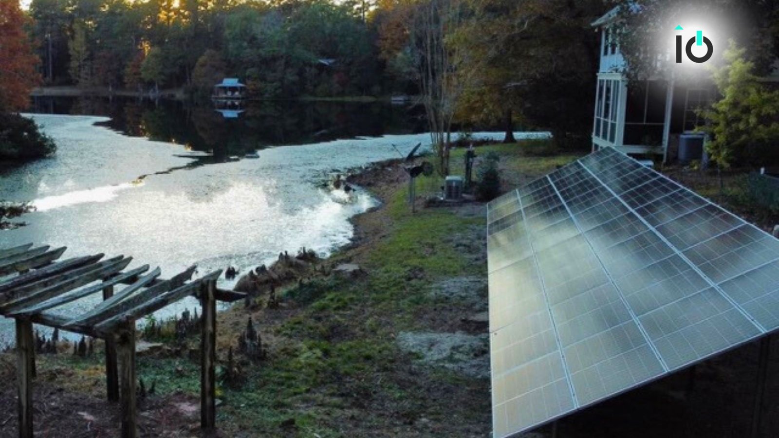 Ground-mounted solar array on a wooded lakeside property