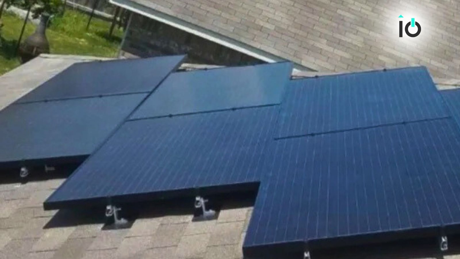 Solar panels installed across a shingle roof