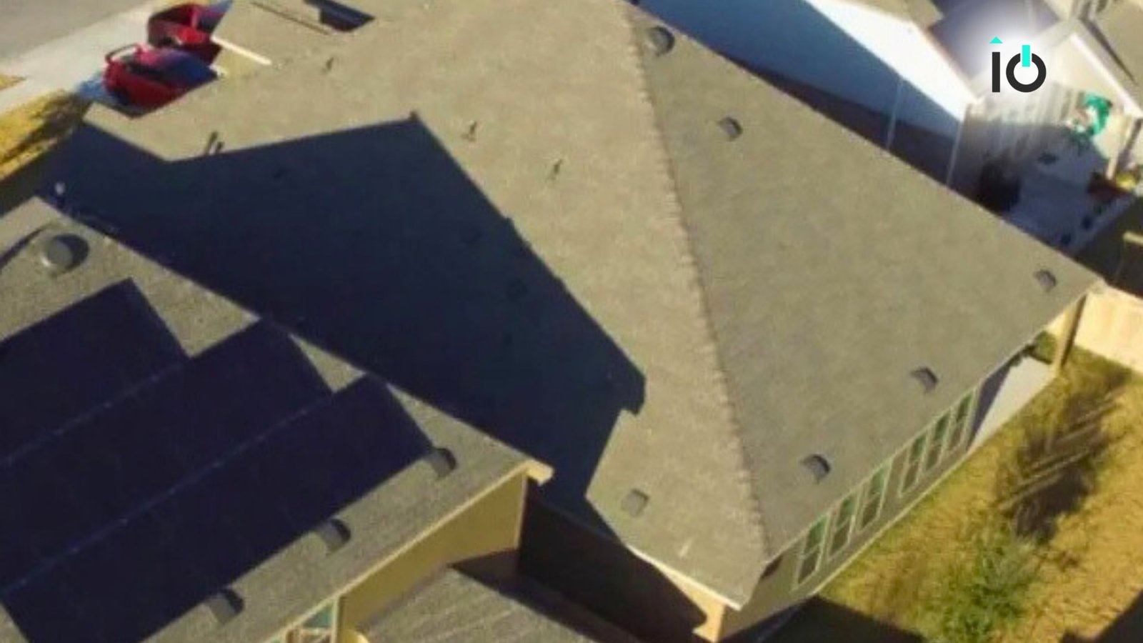 Aerial view of a home with a rooftop solar array