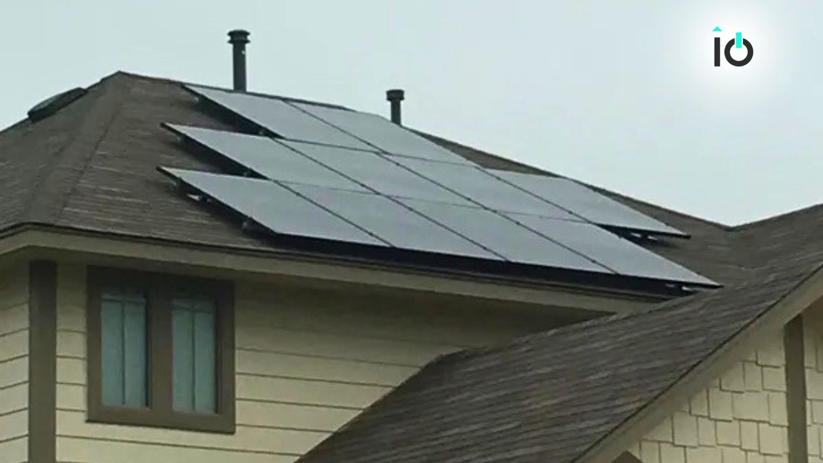Solar array on a residential roof beside a vent stack