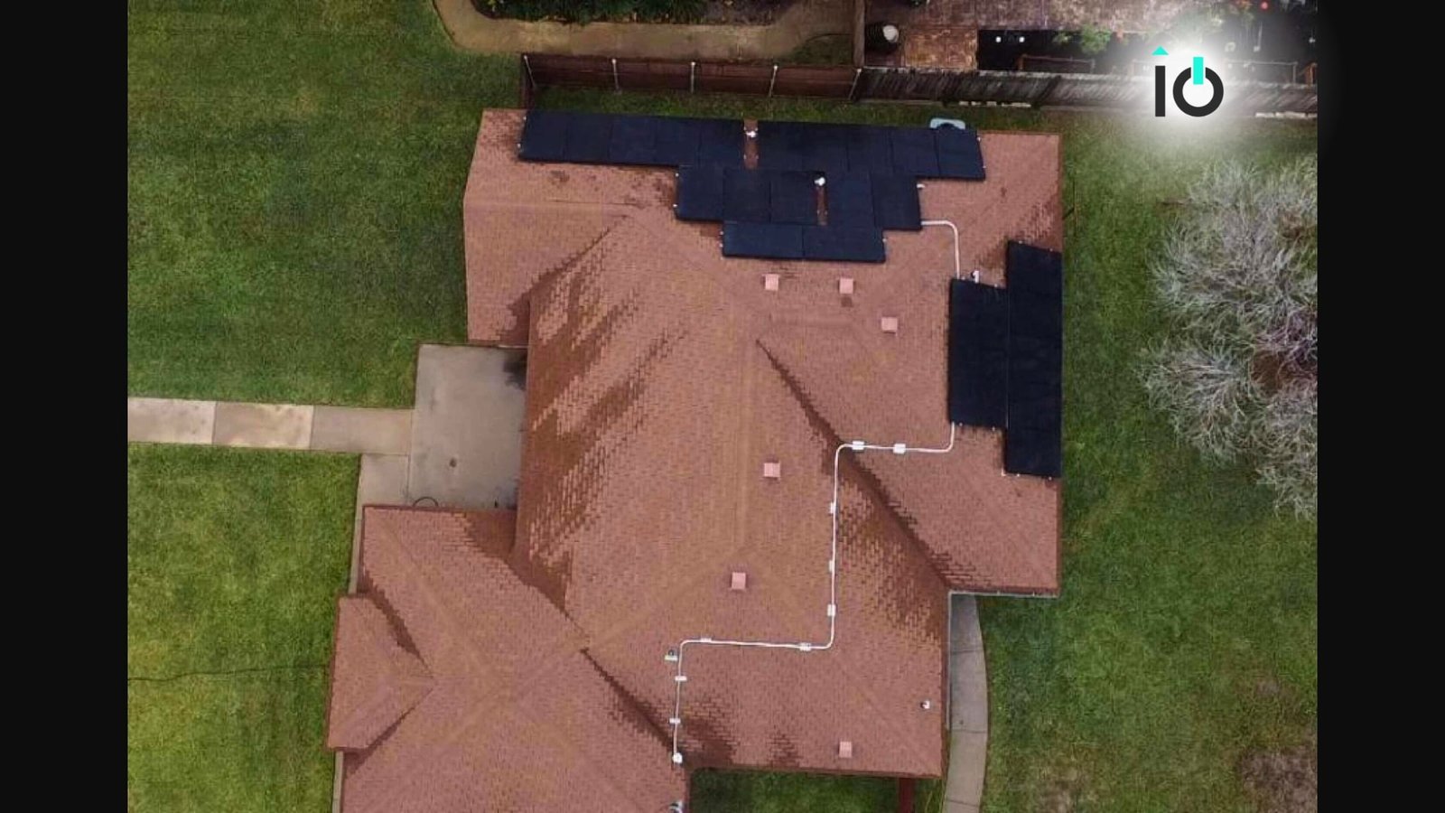 Aerial view of a residential rooftop solar installation