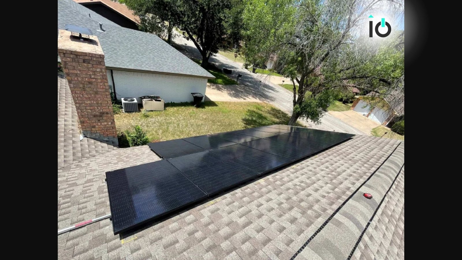 Close view of solar panels on a shingle roof
