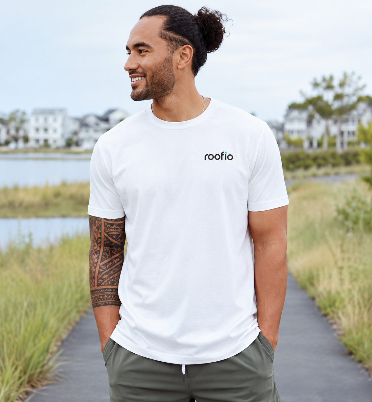 Model wearing the white Roofio Everyday Tee with a small Roofio logo on the left chest