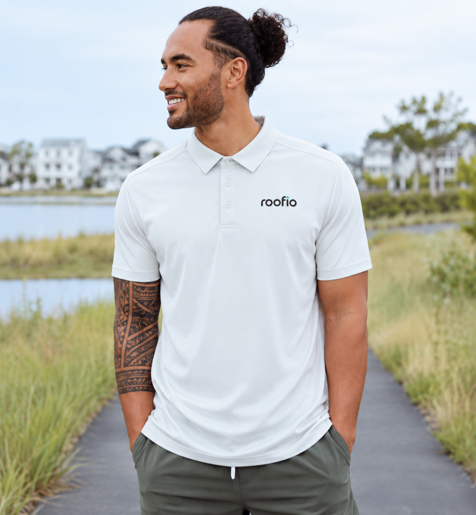 Model wearing the light-colored Roofio Palmer Polo with a small Roofio logo on the left chest